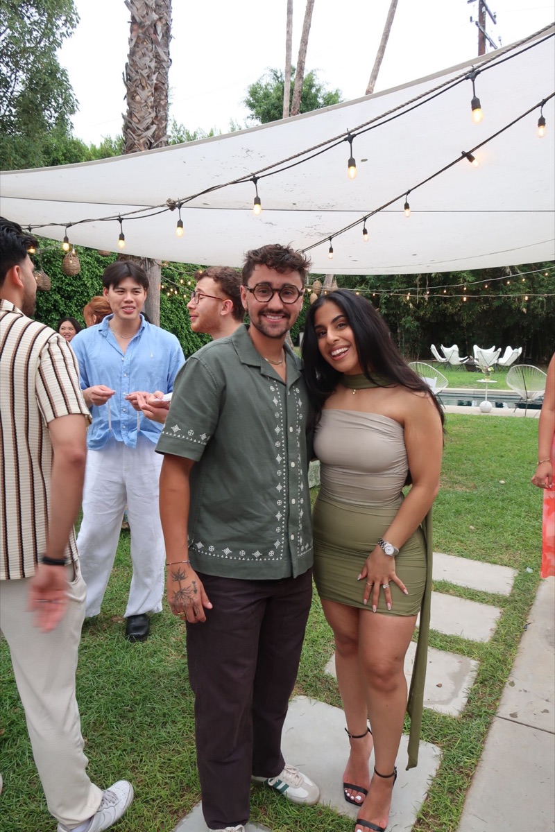 Mehr smiling with a creator at the AHA garden party