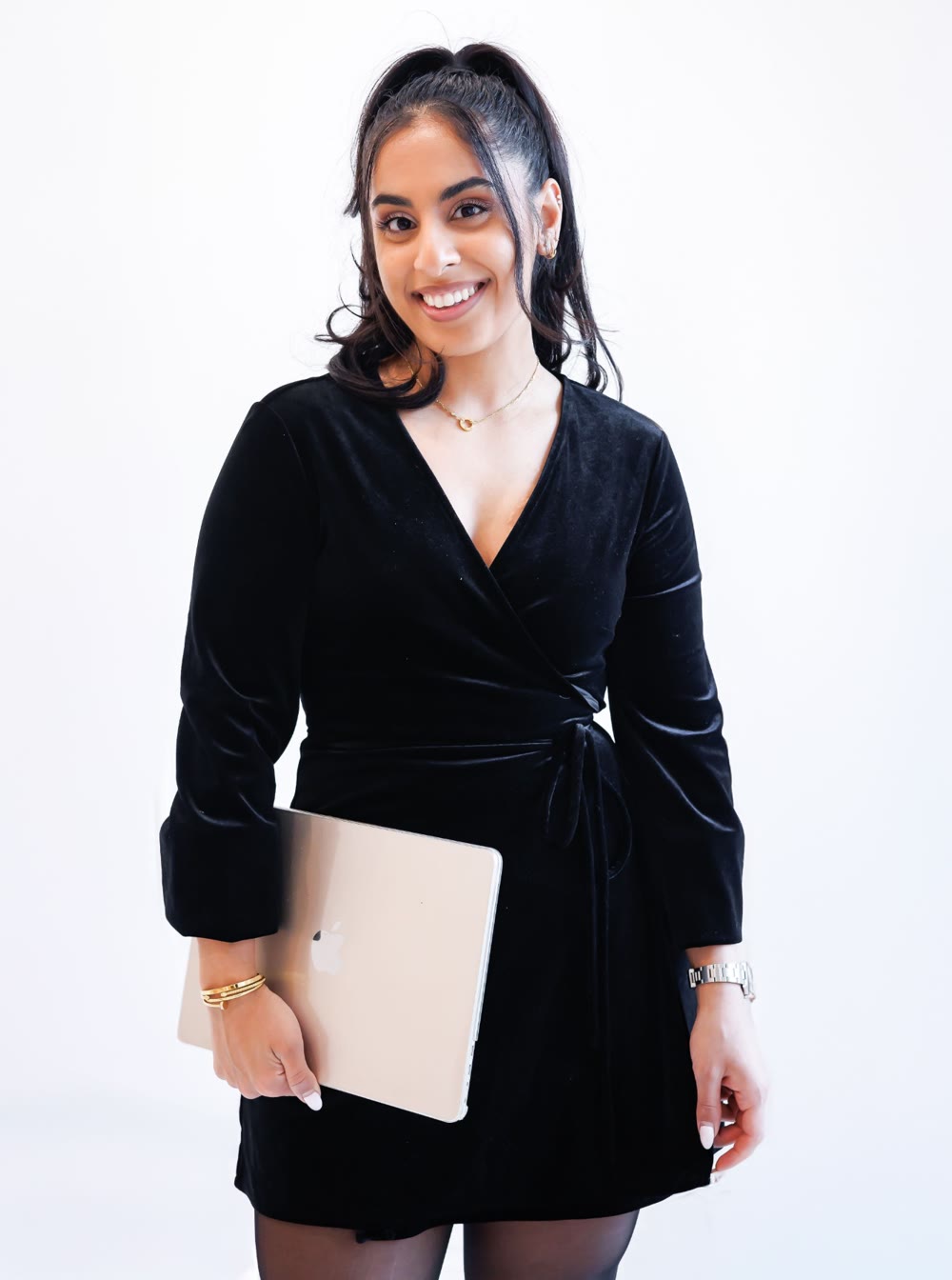 Mehr Rajput holding a laptop