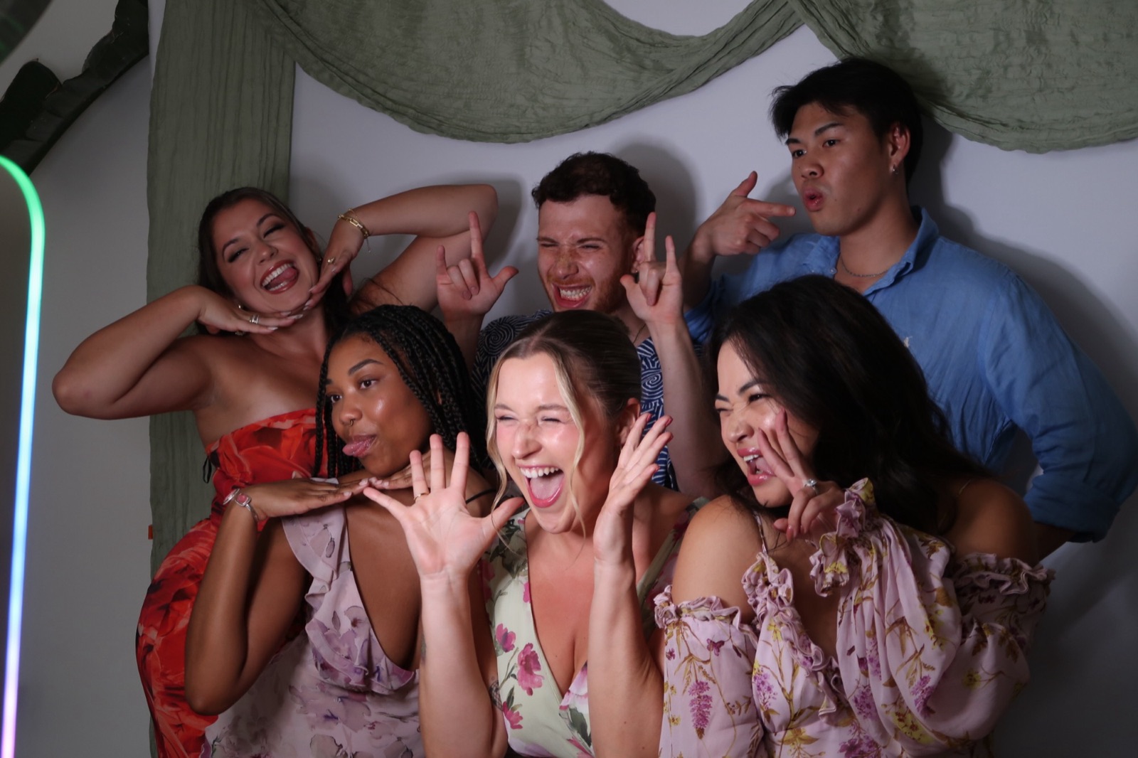AHA creators goofing around in a photobooth